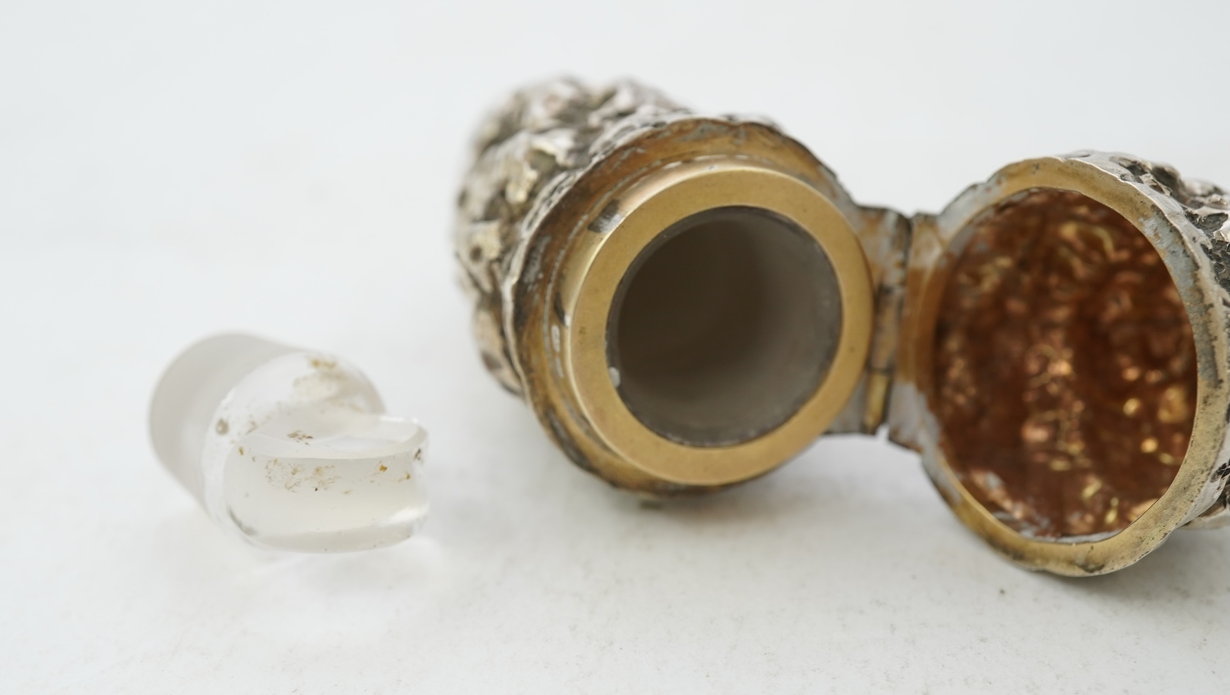 A late Victorian novelty silver scent flask, modelled as a 'gold nugget' by George Ward